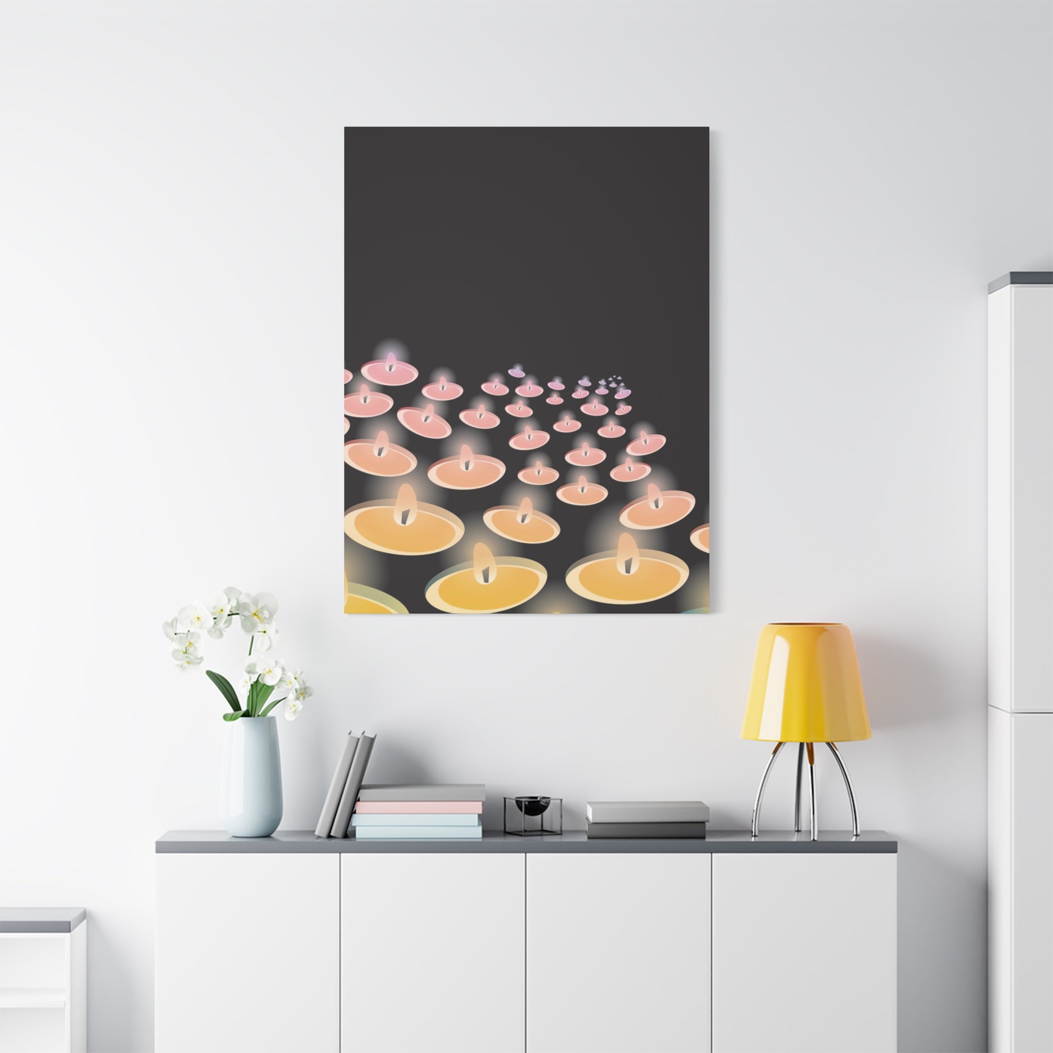 Framed artwork of candles on a white wall above a shelf with decor items.
